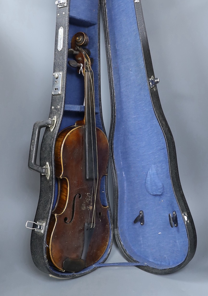 A cased German violin, labelled Stradivarius and dated 1886, back measures 36cm excl button